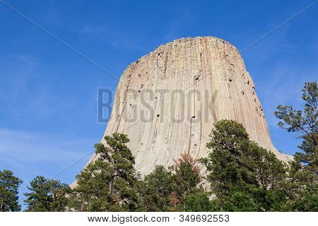 The Spectacular Vertical Rock Columns That Form Devils Tower National Monument In Wyoming Against A 