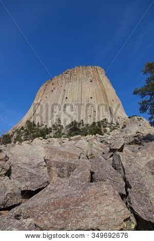 The Spectacular Vertical Rock Columns That Form Devils Tower National Monument In Wyoming Against A 