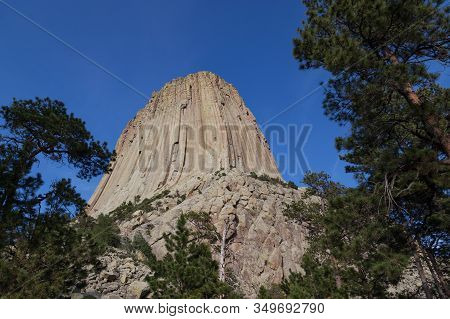 The Spectacular Vertical Rock Columns That Form Devils Tower National Monument In Wyoming Against A 