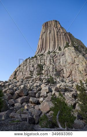 The Spectacular Vertical Rock Columns That Form Devils Tower National Monument In Wyoming Against A 