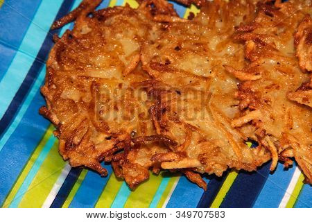 Potato Pancakes On A Blue Striped Background