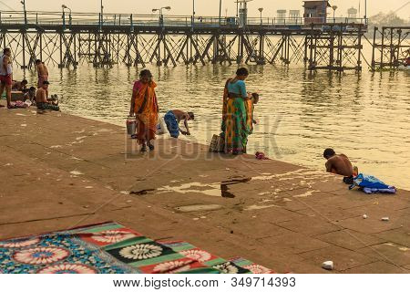 Kolkata, India - March 11, 2019:indian People Bathing In River Hooghly Or Ganga At Mallick Ghat In S