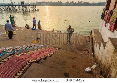 Kolkata, India - March 11, 2019:indian People Bathing In River Hooghly Or Ganga At Mallick Ghat In S