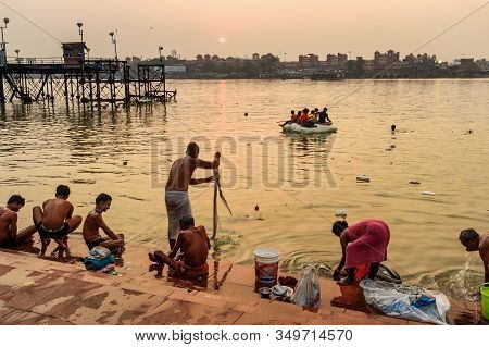 Kolkata, India - March 11, 2019:indian People Bathing In River Hooghly Or Ganga At Mallick Ghat In S