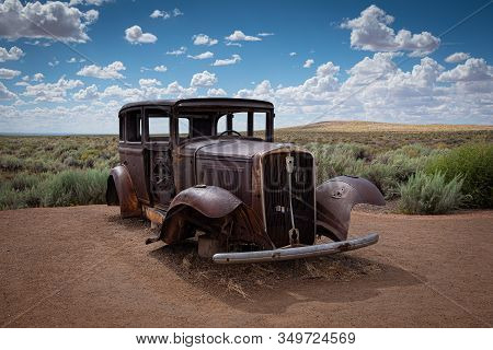 An Old Antique, Rusty Jalopy Circa 1930 On The Side Of The Road At The Petrified Forest National Par