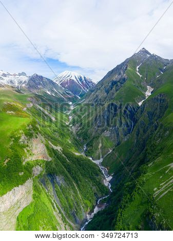 Caucasus Mountains. Georgian Military Road. Kudskoe Or Gudskoe Gorge And Extinct Sherkhot Volcano On
