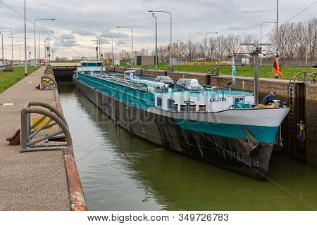 Maasbracht, The Netherlands - March 20, 2019: Big Barge In Lock Of Canal Julianakanaal Near River Me
