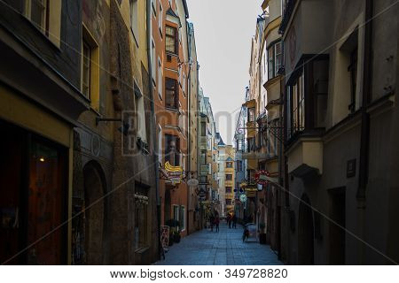 Insbruk, Austria - February 2020:pedestrians, Residents And Tourists In The Narrow Streets Of The Ol