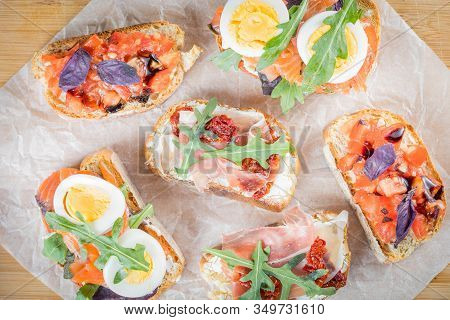 Bruschetta With Tomato And Basil, Bruscetta With Salmon And Eggs, Bruscetta With Prosceutto And Ruco