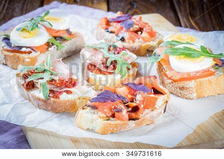 Bruschetta With Tomato And Basil, Bruscetta With Salmon And Eggs, Bruscetta With Prosceutto And Ruco