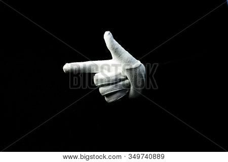 A Hand Wearing White Glove On Black Background Showing Number 2 Sign