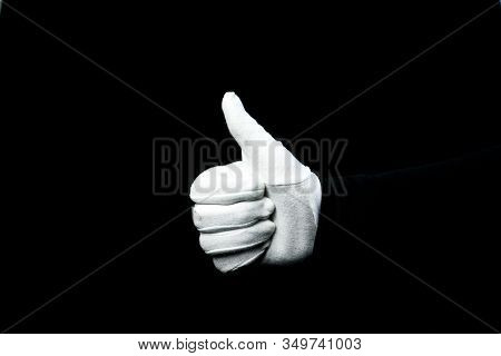 A Hand Wearing White Glove On Black Background Counting Down