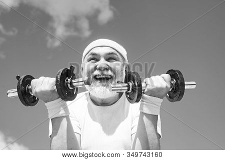 Summer And Active Holidays. Happy Grandfather Sportsman Portrait On Blue Sky Backgrounds. Healthcare