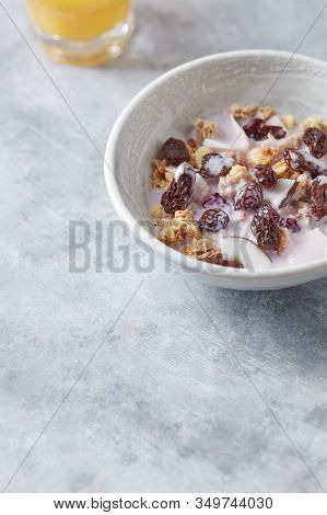 Bowl Of Granola With Yogurt, Nuts, Cranberry And Cocoanut. Concept For A Tasty And Healthy Meal. Sto