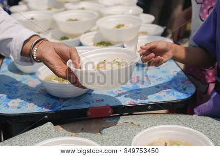 Hand Begging For Food From The Rich's Share : The Beggar Is Waiting For Food From Charity Aid : The 