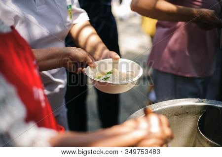 Hand Begging For Food From The Rich's Share : The Beggar Is Waiting For Food From Charity Aid : The 