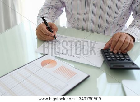 Accounting Audit Business Concept. Accuntant  Using Calculator Audit Financial Statement.
