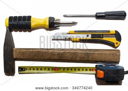 Hammer, Screwdriver, Construction Knives And Measuring Tape Isolated. Top View On Construction Tools