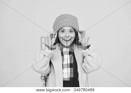 Winter Hat Accessory. Girl Long Hair Yellow Background. Cold Season Concept. Winter Fashion Accessor