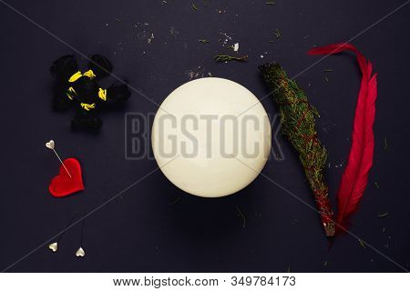 Top View Esoteric Still Life Doll Made Of Human Hair, Heart, Pins, Juniper, Red Feather And Crystal 