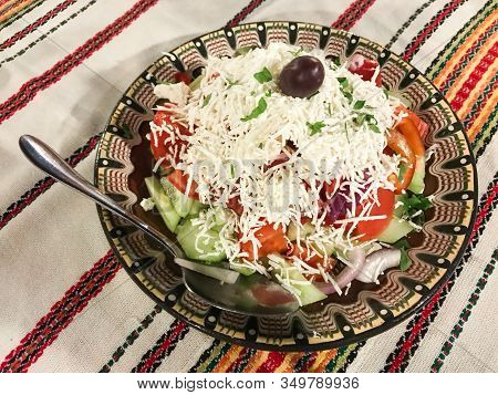 A Large Bowl With Shopsky Salad Of Vegetables And Cheese - The National Bulgarian Food. Bowl And Tab