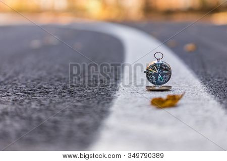 Conceptual Landscape With A Metallic Compass On The Leading Lines Of The Road,sfanta Ana, Romania