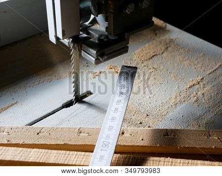 Wooden Ruler , Pine Boards On The Band Saw Table, Focus On The Band Saw Blade With Copy Space.