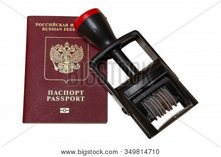 Red Biometric Passport Of A Russian Citizen With A Border Date Stamper, Isolated On White Background