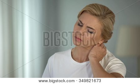Good-looking Blond Woman Suffering Neck Pain, Sedentary Life, Health Problems