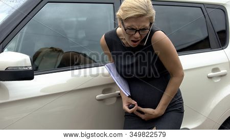 Pregnant Woman Talking Phone Near Car, Feeling Pain In Tummy, Risk Of Misbirth