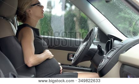 Pregnant Female Driver Feeling Sharp Pain In Stomach, Worrying About Baby Health