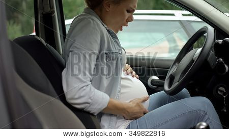 Pregnant Female Sitting In Auto And Feeling Pain In Stomach, Risk Of Misbirth