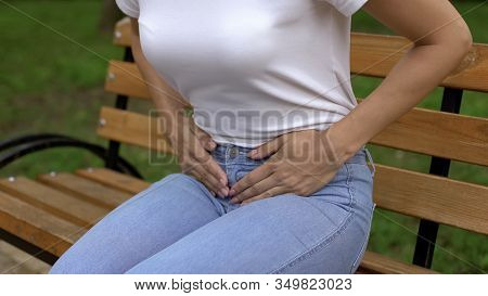 Woman Suffering From Cystitis, Touching Abdomen And Feeling Pain, Healthcare