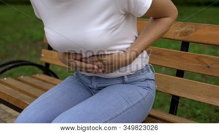 Slim Female Feeling Sharp Stomachache, Suffering From Ulcer In Park, Health Care