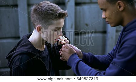 Teenager Learning To Smoke With Older Friend, Bad Influence Of Street Life