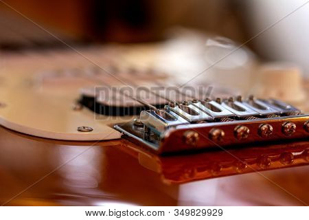 Brecht/belgium - December 31 2018: A Close Up Portrait Of The Bridge And The Bridge Pins Of A Guitar