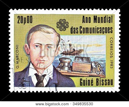 Cancelled Postage Stamp Printed By Guinea Bissau, That Shows Portrait Of Scientist Marconi, Circa 19