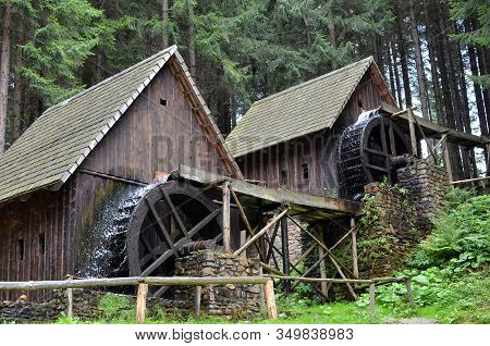 Two Old Wooden Water Mill With Mill-wheel Detail Photo