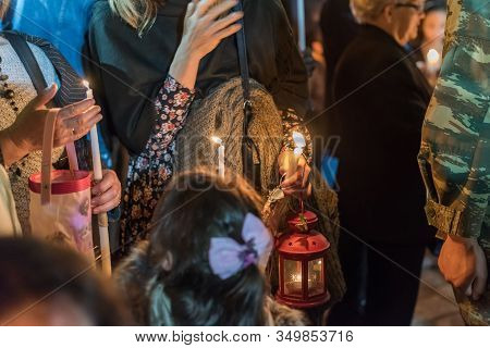 People Holding Candle At Night During Church Service