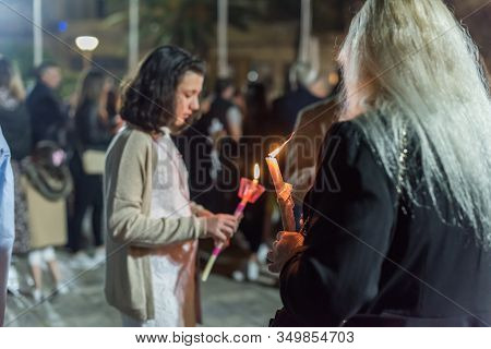 Heraklion, Crete, Greece - 28 April 2019: People Celebration With Lit Candles Easter Night Outside A