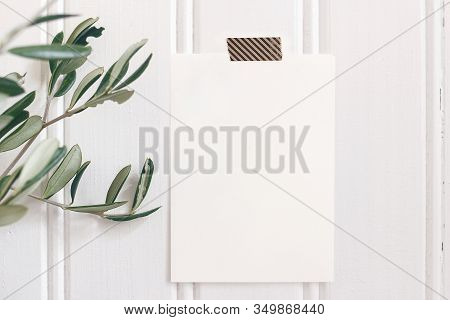 Summer Wedding Mock-up Scene. Closeup Of Blank Greeting Card, Invitation Taped On White Wooden Board