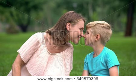 Mother And Son Nuzzling, Spending Time Together Outdoors, Unity Of Loving Family