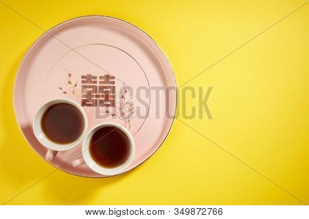 Teapot and cups used in traditional Chinese wedding ceremony with chinese sign meaning happinese. Translation: Double Happiness