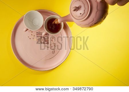 Teapot and cups used in traditional Chinese wedding ceremony with chinese sign meaning happinese. Translation: Double Happiness