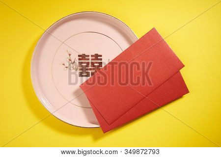 Teapot and cups used in traditional Chinese wedding ceremony with chinese sign meaning happinese. Translation: Double Happiness