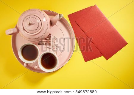 Teapot and cups used in traditional Chinese wedding ceremony with chinese sign meaning happinese. Translation: Double Happiness