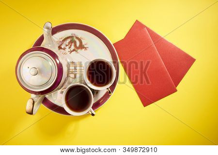 Teapot and cups used in traditional Chinese wedding ceremony with chinese sign meaning happinese. Translation: Double Happiness