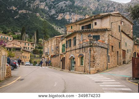 Deia, Mallorca, Spain - March 19 2018: Tourists Walking In The Streets Of Deia Town At The West Coas