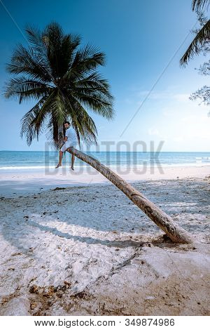 Thung Wua Laen Beach Chumphon Thailand, Men On The Beach By Palm Tree Hanging On The White Beach