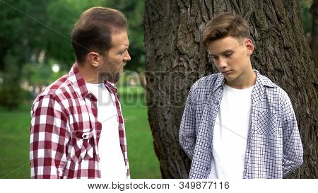 Father Scolding Teenage Son, Generation Gap, Awkward Age And Misunderstanding